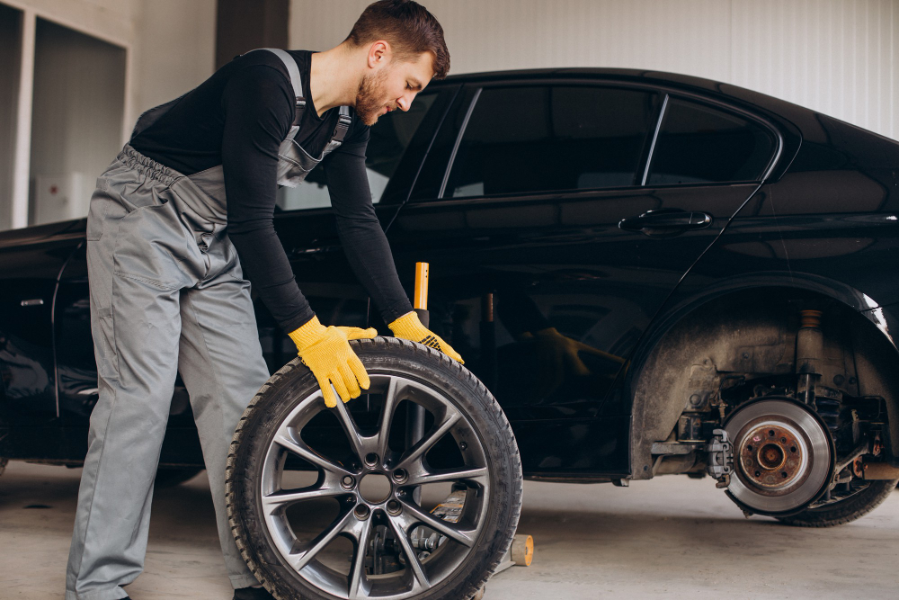 Technician handling a tire with a durable tread pattern